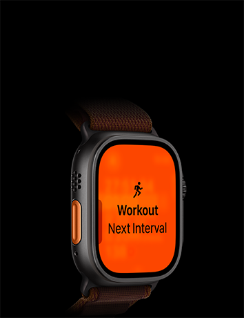 Apple Watch Ultra 4 med urkasse i sort titanium, træningstypen Løb og næste interval, orange Handlingsknap i venstre side, Alpine Loop-rem