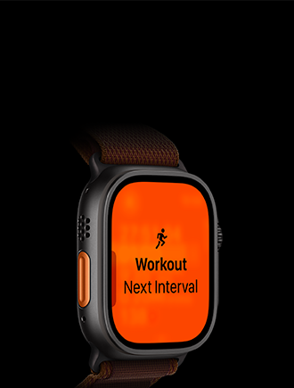 Apple Watch Ultra 4 med urkasse i sort titanium, træningstypen Løb og næste interval, orange Handlingsknap i venstre side, Alpine Loop-rem